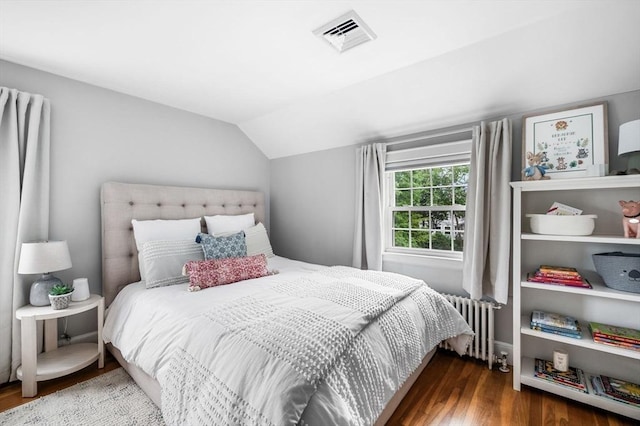 42 Pickwick Rd, Marblehead, MA 01945 - bedroom with radiator heating unit, wood finished floors, and vaulted ceiling