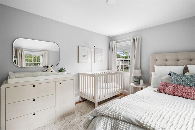 42 Pickwick Rd, Marblehead, MA 01945 - bedroom with multiple windows and light wood-type flooring