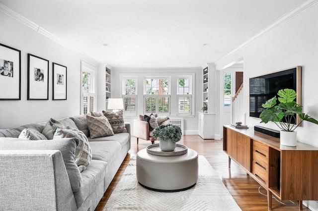 42 Pickwick Rd, Marblehead, MA 01945 - living area with light wood-style flooring, ornamental molding, and built in features