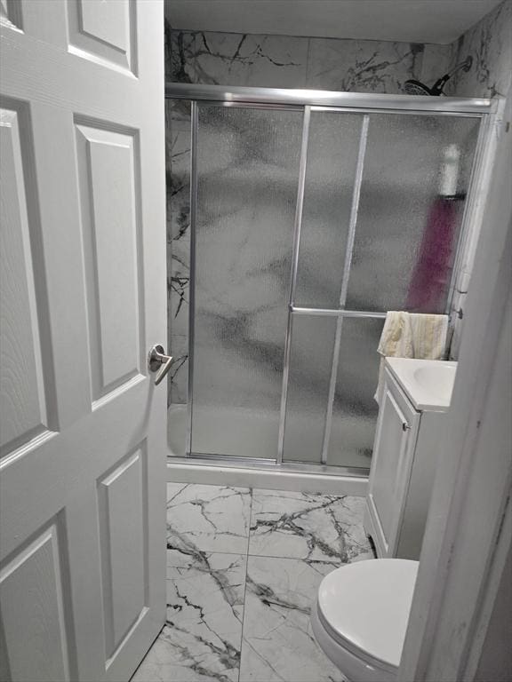 68 Temple St, Haverhill, MA 01832 - full bathroom with marble look tile flooring, vanity, and a stall shower