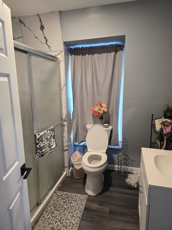 68 Temple St, Haverhill, MA 01832 - full bathroom with vanity, a stall shower, and wood finished floors