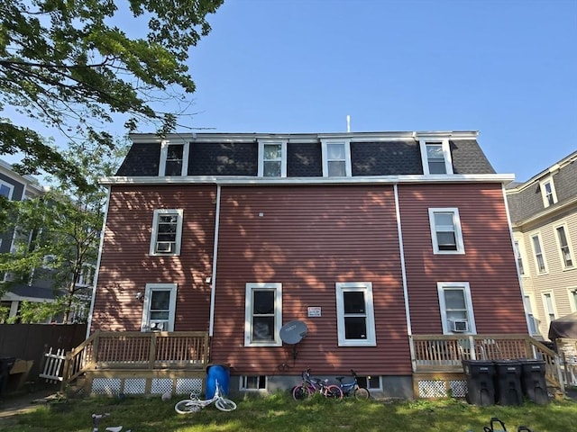 68 Temple St, Haverhill, MA 01832 - back of house with mansard roof, a deck, and cooling unit