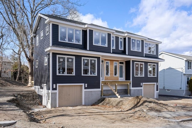 view of front of property featuring a garage