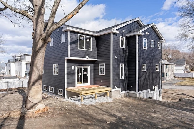 back of house featuring fence