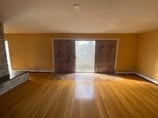 unfurnished living room featuring wood finished floors