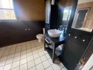 bathroom featuring vanity, toilet, and tile patterned flooring