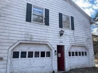 view of property exterior with an attached garage