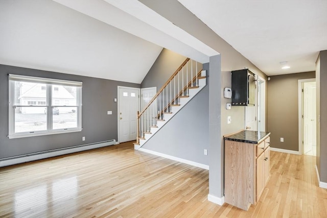 105 Edgewater Dr W, Falmouth, MA 02536 - entrance foyer featuring baseboard heating, baseboards, stairway, and light wood-style flooring