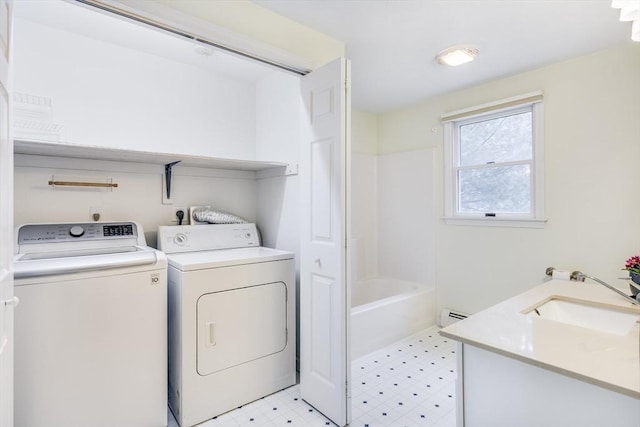105 Edgewater Dr W, Falmouth, MA 02536 - washroom featuring light floors, laundry area, a sink, and washer and clothes dryer