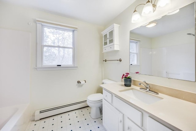 105 Edgewater Dr W, Falmouth, MA 02536 - full bathroom featuring a baseboard heating unit, a wealth of natural light, toilet, and tile patterned floors