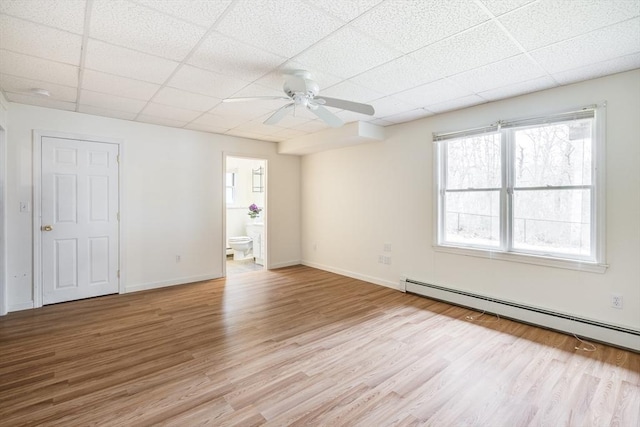 105 Edgewater Dr W, Falmouth, MA 02536 - interior space with baseboard heating, a ceiling fan, light wood-style floors, and a paneled ceiling