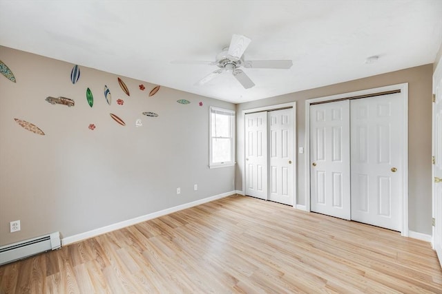 105 Edgewater Dr W, Falmouth, MA 02536 - unfurnished bedroom featuring light wood-style flooring, multiple closets, and baseboard heating