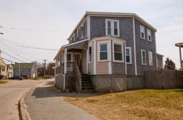 view of property exterior featuring a lawn