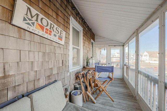 sunroom / solarium with vaulted ceiling