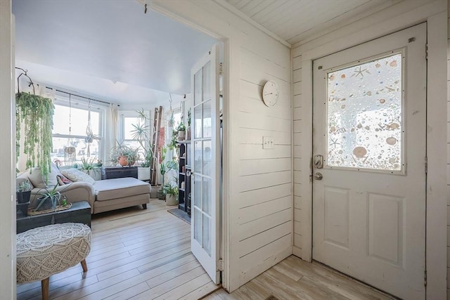 entryway with light hardwood / wood-style floors