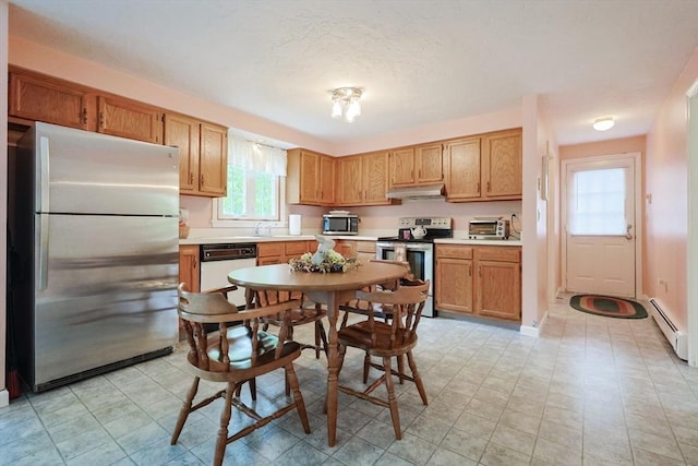 119 Messenger St, Plainville, MA 02762 - kitchen featuring stainless steel appliances, under cabinet range hood, baseboard heating, light countertops, and a sink
