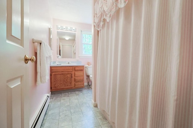 119 Messenger St, Plainville, MA 02762 - full bathroom with baseboard heating, toilet, and vanity