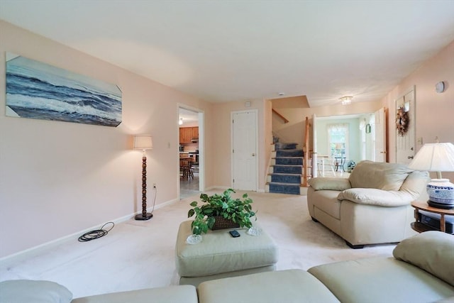 119 Messenger St, Plainville, MA 02762 - living room with stairs, light carpet, and baseboards