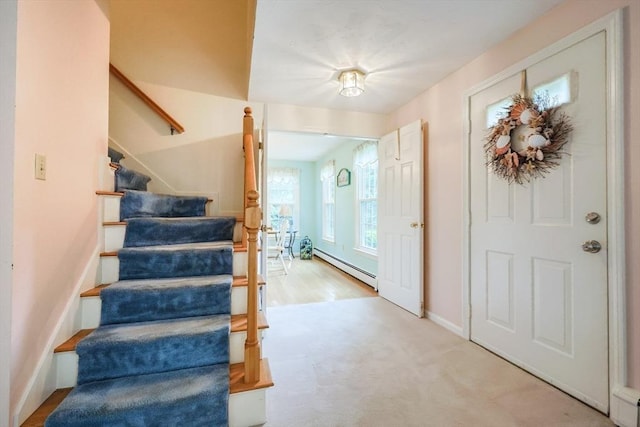 119 Messenger St, Plainville, MA 02762 - entrance foyer featuring a baseboard radiator, stairs, baseboards, and light carpet