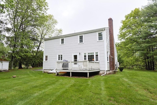 119 Messenger St, Plainville, MA 02762 - rear view of property featuring a chimney, a deck, and a lawn