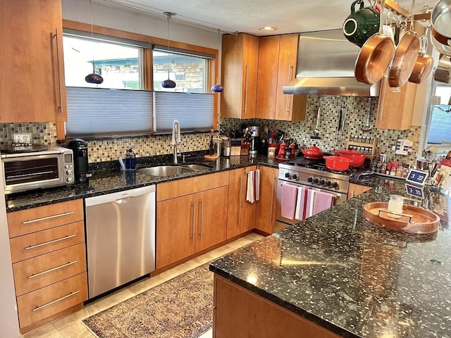 16 Howard Ave, Wells, ME 04090 - kitchen with appliances with stainless steel finishes, a sink, exhaust hood, and tasteful backsplash