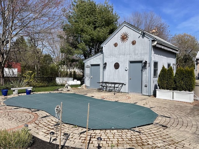 16 Howard Ave, Wells, ME 04090 - view of swimming pool featuring a patio area and an outbuilding