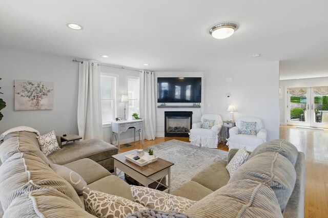 96 Sea Ave, Quincy, MA 02169 - living room featuring wood finished floors, a fireplace, french doors, and recessed lighting