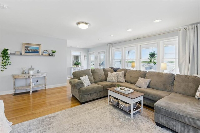 96 Sea Ave, Quincy, MA 02169 - living area with wood finished floors, baseboards, and recessed lighting