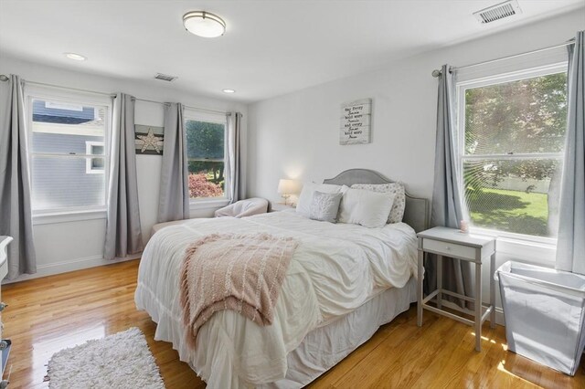 96 Sea Ave, Quincy, MA 02169 - bedroom with multiple windows, light wood-style flooring, and recessed lighting