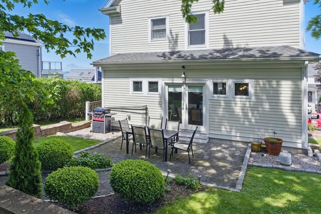 96 Sea Ave, Quincy, MA 02169 - rear view of property with a patio, french doors, and roof with shingles