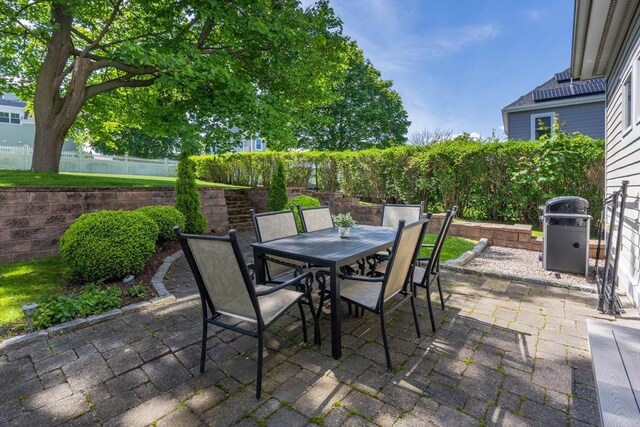 96 Sea Ave, Quincy, MA 02169 - fenced backyard with a patio area, outdoor dining space, and grilling area