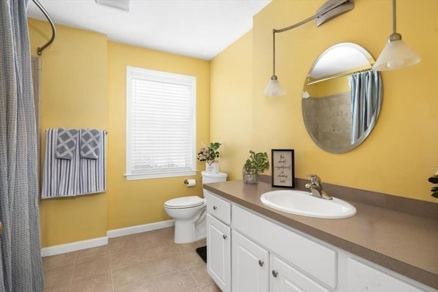 bathroom with vanity, curtained shower, toilet, baseboards, and tile patterned floors