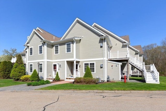 view of front of house with stairs