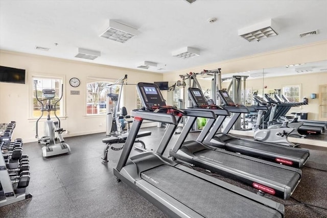 gym with baseboards and visible vents