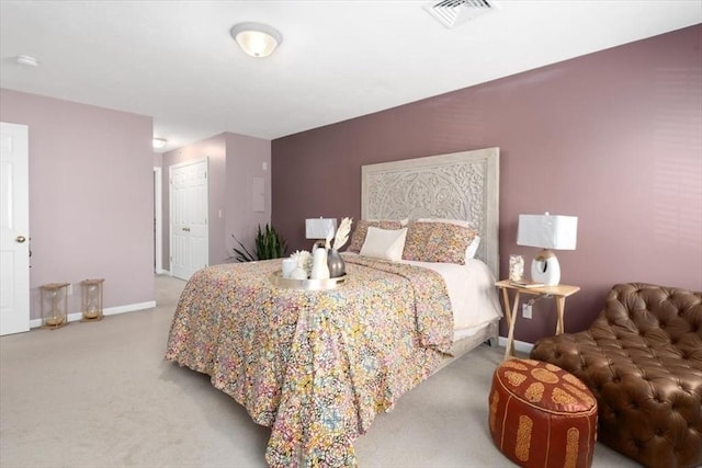 carpeted bedroom with baseboards, a closet, and visible vents