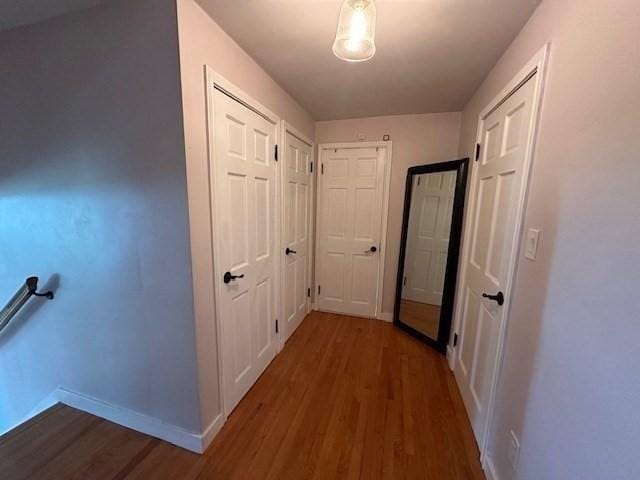 corridor with dark wood-type flooring