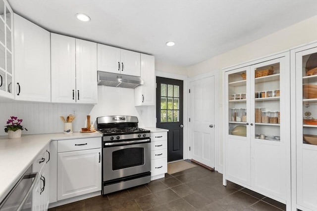 kitchen featuring light countertops, appliances with stainless steel finishes, white cabinets, and under cabinet range hood