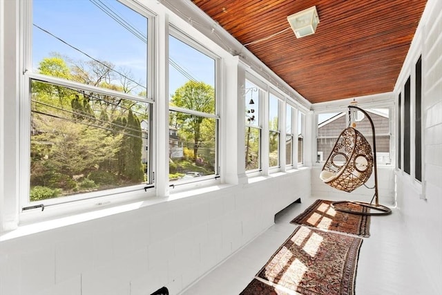 sunroom / solarium with wooden ceiling and a wealth of natural light