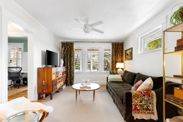 living area with plenty of natural light and a ceiling fan