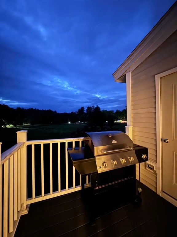 deck at dusk with a grill