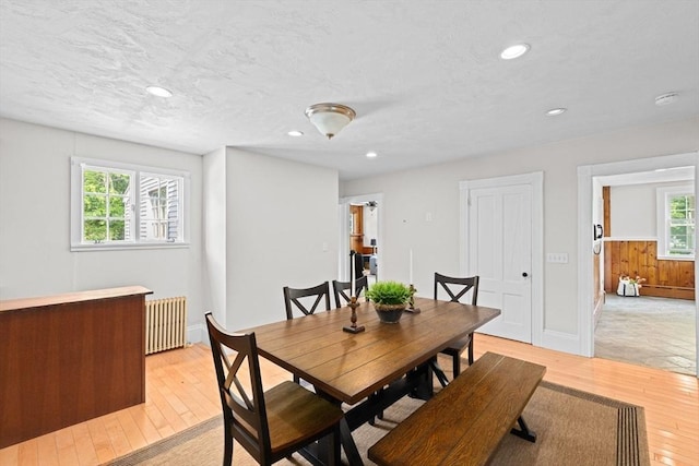 553 Center St, Hanover, MA 02339 - dining room with radiator, light wood finished floors, and recessed lighting