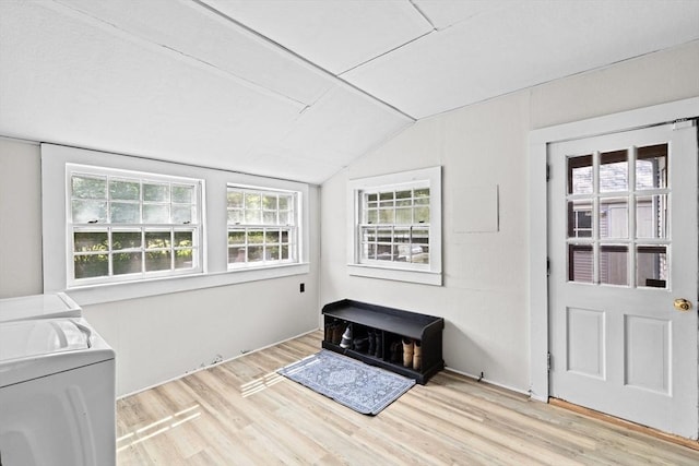 553 Center St, Hanover, MA 02339 - foyer with washing machine and clothes dryer, vaulted ceiling, and wood finished floors