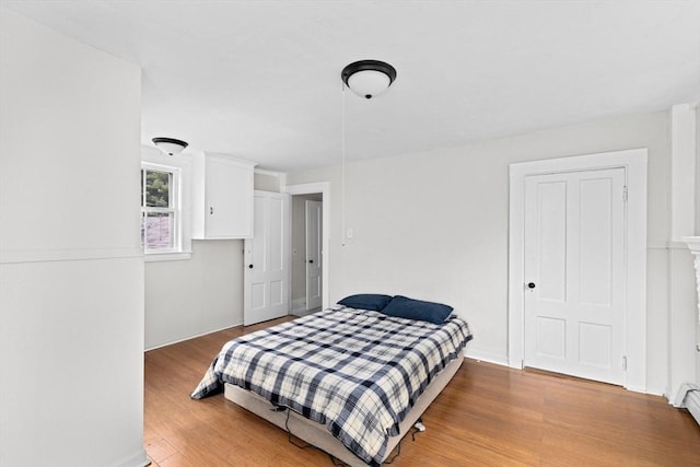 553 Center St, Hanover, MA 02339 - bedroom with wood finished floors and baseboard heating