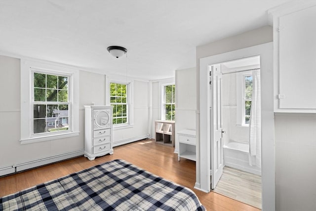 553 Center St, Hanover, MA 02339 - unfurnished bedroom with light wood-type flooring, a baseboard heating unit, ensuite bathroom, and baseboard heating