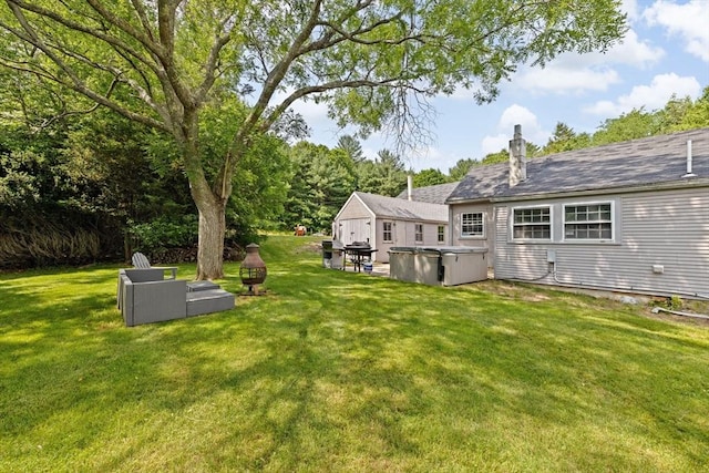 553 Center St, Hanover, MA 02339 - view of grassy yard with a hot tub