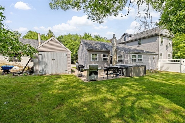 553 Center St, Hanover, MA 02339 - rear view of property featuring a shed, a patio area, and a hot tub