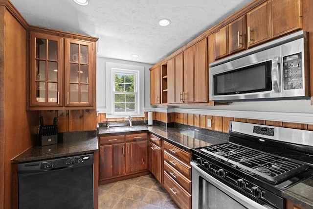 553 Center St, Hanover, MA 02339 - kitchen featuring appliances with stainless steel finishes, recessed lighting, open shelves, glass insert cabinets, and brown cabinetry