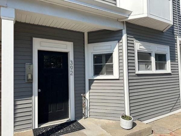 view of exterior entry with covered porch