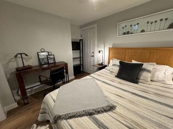 bedroom featuring dark hardwood / wood-style floors and ceiling fan