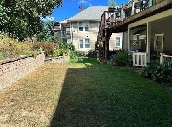 view of yard with a wooden deck